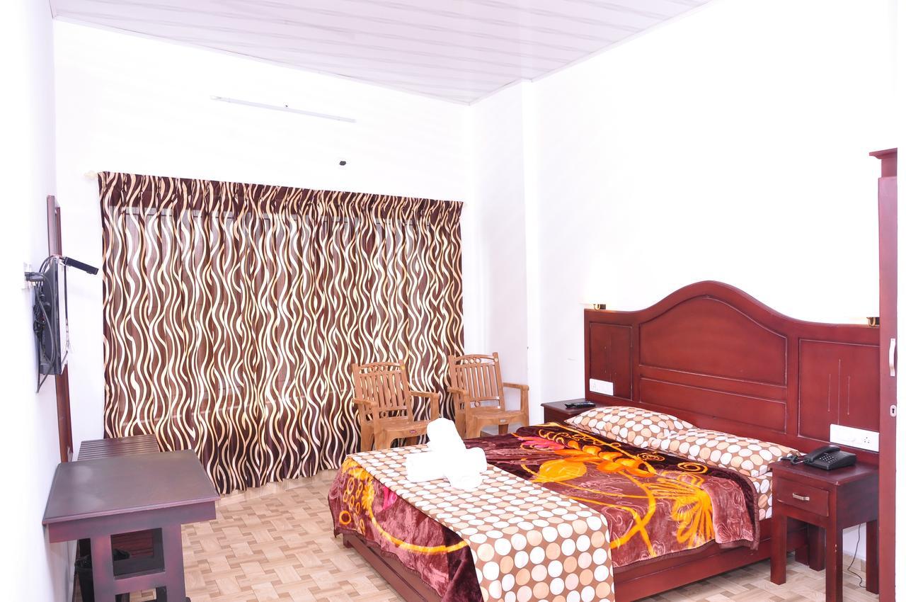 Natura Inn Munnar Buitenkant foto